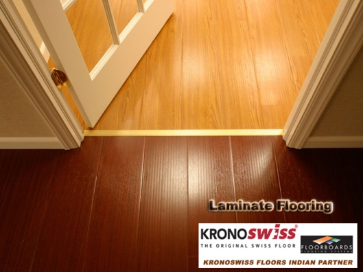 Wood laminate flooring installed on a basement floor.